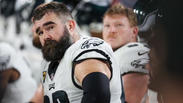 Jason Kelce looks over his
                                                                                 shoulder as he sits down in an Eagles
                                                                                 uniform